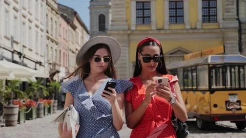 Two friends using smartphone for likes, followers, comments for social media. Stock Footage 138079468