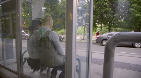 Two friends wait at the station together Stock Footage 54100038