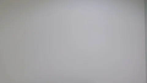 Two friends walk in frame meet and hug and smile and then look and point at the  Stock Footage 100026625