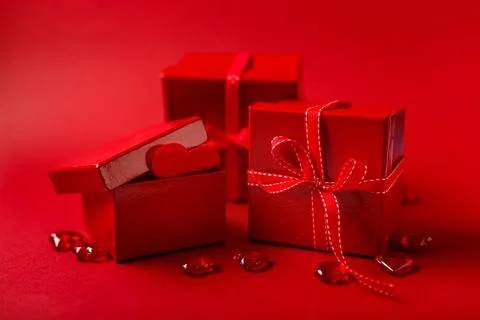 Two full glasses of wine over red background Stock Photos