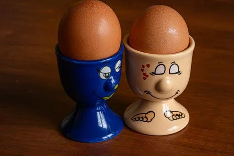 Two fun ceramic stands for boiled eggs Stock Photos