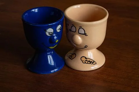 Two fun ceramic stands for boiled eggs Stock Photos