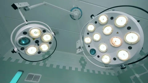 Two functioning medical lamps hanging under the ceiling Video stock 94536884