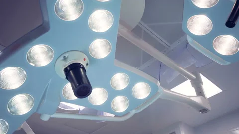Two functioning surgical lamps of irregular shape. Technologically Advanced 動画素材 95273129