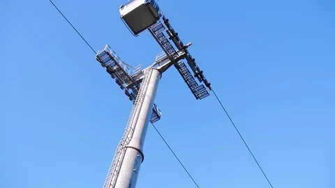Two funiculars are moving towards each other against the blue sky. Movement Stock Footage 101099566