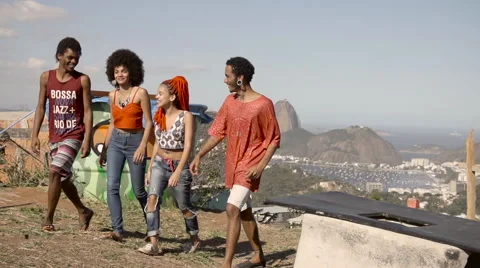 Two funky young couples talking while walking together Video stock 61292455