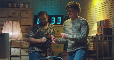 Two funny Caucasian friendly men nerds in glasses and old style clothes dancing Stock Footage 135630933