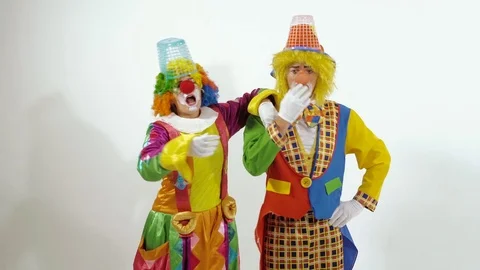 Two funny clowns singing and dancing against white background Stock-Footage 70283198