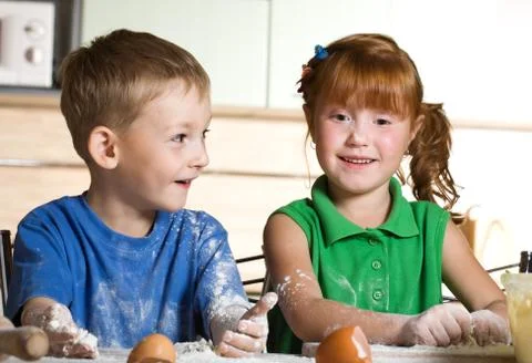 Two funny cooks Stock Photos