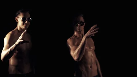 Two funny guys on a black background Stock Footage 85881816