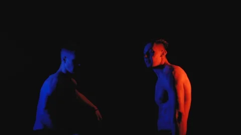 Two funny guys in color lights Stock Footage 100598216