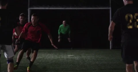 Two Futbol forwards make it through the defense, but cannot score a goal. Stock Footage 69212786