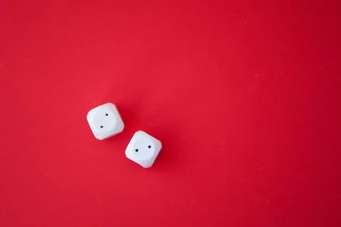 Two game dices, two white tiles on red background Stock Photos
