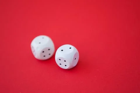 Two game dices, two white tiles on red background Stock Photos