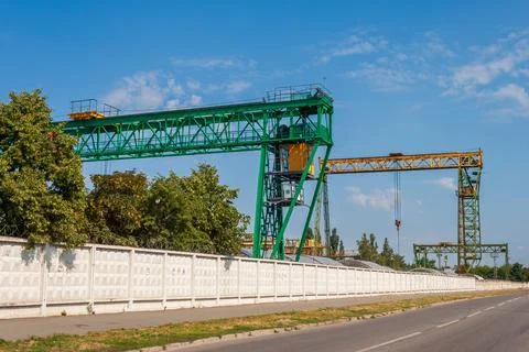 Two gantry cranes in concrete batching plant Stock Photos