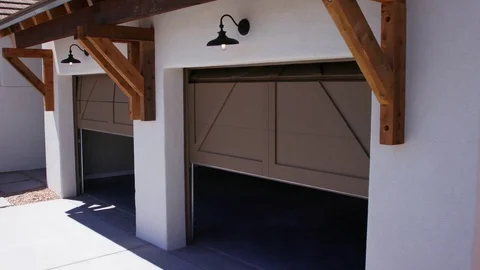 Two Garage Doors Close Lowering View from Corner Angle of Garage Video stock 76256100