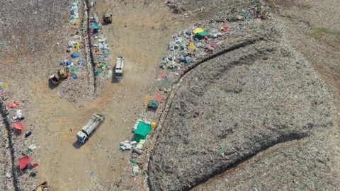 Two Garbage Trucks Reversing To Dump Waste At A Dump Yard Stockbeeldmateriaal 341462516