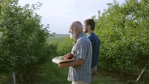 Two gardener go to the garden Stock Footage 78673729