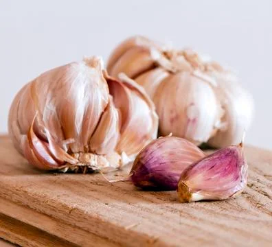 Two garlic bulbs and cloves Stock Photos