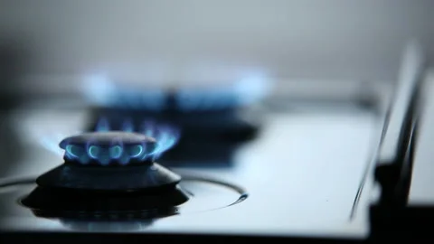 Two Gas Flames on Kitchen Stove with Dynamic Focus Shift Stock Footage 220641863