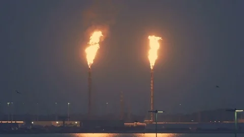 Two gas flares burning at night, close up Stock Footage 117834483