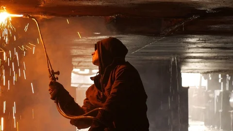 Two gas welders under the ship cut metal Stock-Footage 87505356