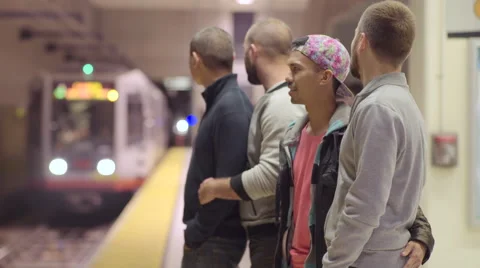 Two Gay Couples Wait On Platform For Subway Train In San Francisco Stock-Footage 56399829
