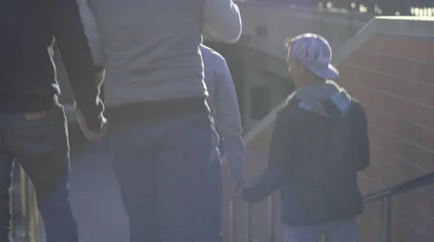 Two Gay Couples Walk Down Stairs Outside On A Sunny Day Stock Footage 56371720
