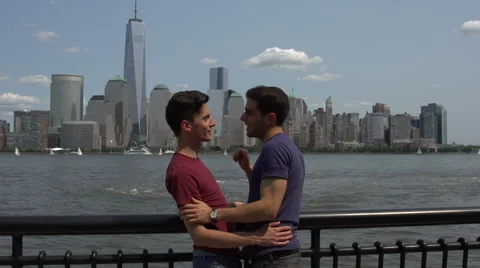 Two gay men point out Manhattan landmarks, talk and embrace Stock Footage 44110384