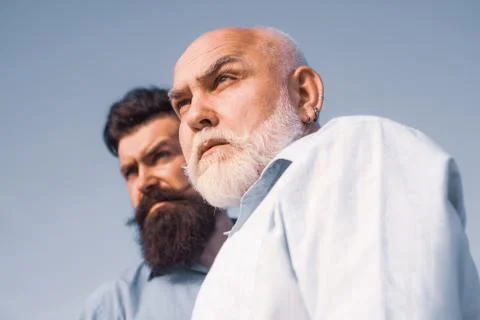 Two generation - weekend together. Elderly Senior man and bearded son - two Stock Photos