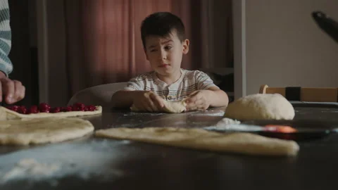 Two generations having fun baking pies at home together, cooking in the kitchen Stock Footage 238889918