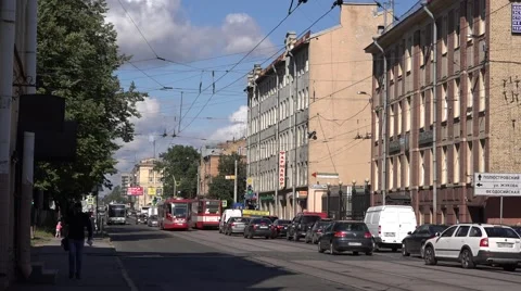 Two generations of trams and a bus meet at Kondratyevsky Prospekt Stock Footage 67468156