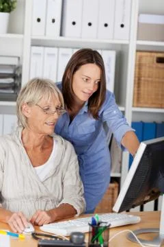 Two generations working together Stock Photos