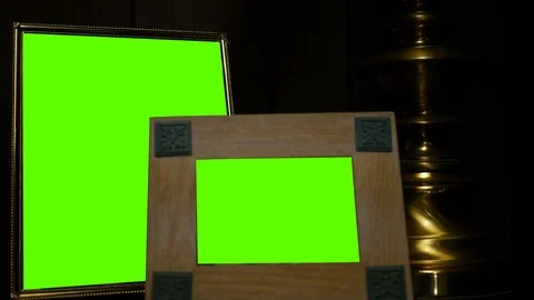 Two generic picture frames with green screens in dark finished room - perfect fo Stock Footage 125167801