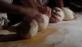 two german baker kneading bread dough spotlight sideview 4k or 4k+ Resolution