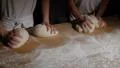 two german baker kneading bread dough spotlight front 4k or 4k+ Resolution