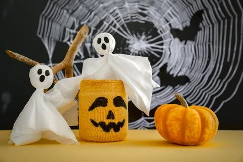 Two ghosts, pumpkin, candlestick, scary Halloween grimace, cobweb. Halloween Stock Photos