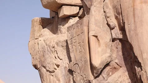 Two giant ruined statues of pharoahs at Colossi of Memnon in Luxor, Egypt Stock Footage 255587860