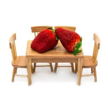 Two giant strawberries on the dining table Stock Photos