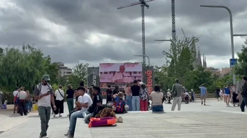 Two giant television screens allow the public to follow the pope's visit to Cata Stock Footage 337542124