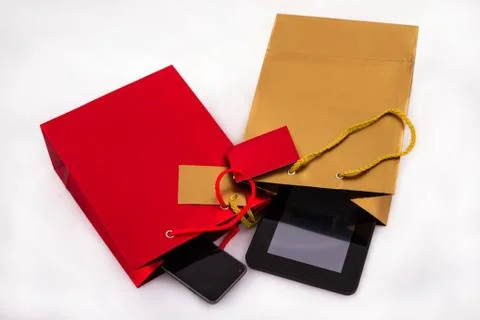 Two gift bags with electronics Stock Photos