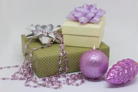 Two gift boxes, ball and bump on white background Stock Photos