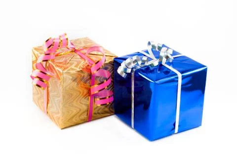 Two gift boxes of  blue and yellow color with silvery and pink tapes. Stock Photos