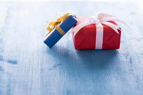 Two gift boxes on blue table Stock Photos