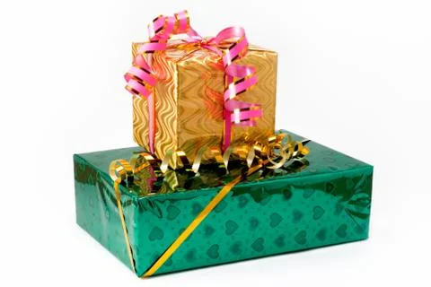 Two gift boxes of green and yellow color with yellow and pink tapes Stock Photos