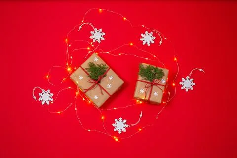Two gift boxes surrounded by snowflakes and christmas light Foto stock