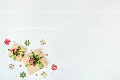Two gift boxes wrapped in kraft paper on white wood desk background Stock Photos