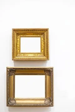 Two gilded wooden frames on a light background Stock Photos