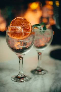 Two gin tonic standing on a bar counter Stock Photos