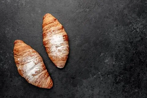 Two ginger root vegetables on dark textured background Stock Photos